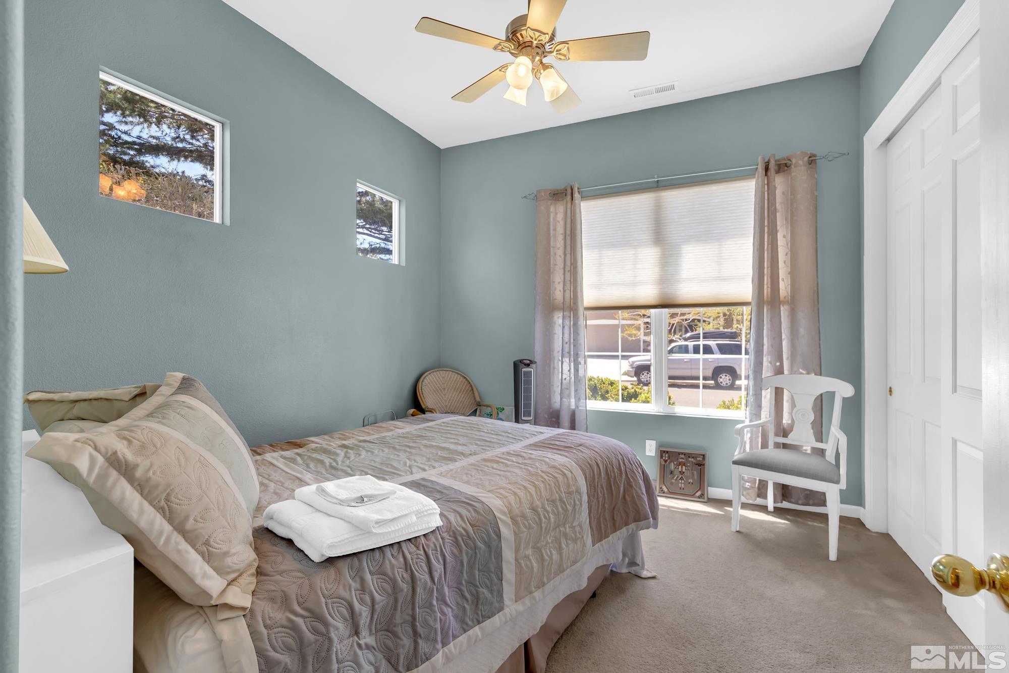 9638 Shadowstone Way Reno, NV 89521 - Photo 30 of 40 a bedroom with a bed and a window