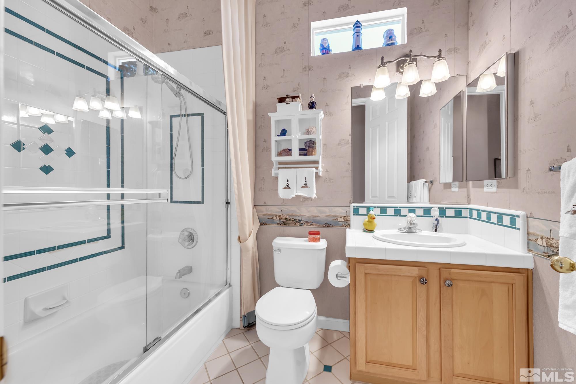 9638 Shadowstone Way Reno, NV 89521 - Photo 31 of 40 a bathroom with a sink toilet and shower