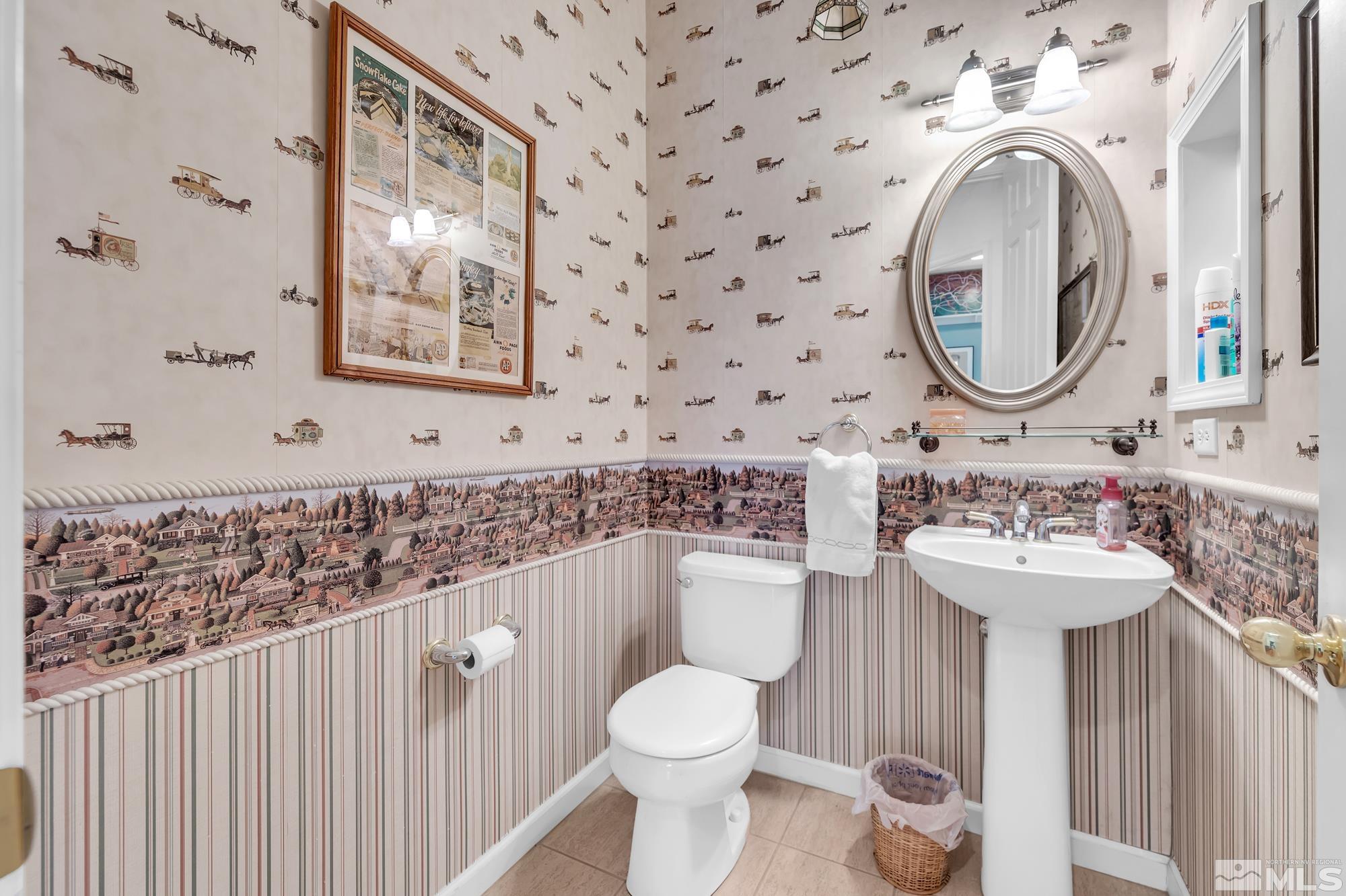 9638 Shadowstone Way Reno, NV 89521 - Photo 32 of 40 a bathroom with a toilet sink and mirror