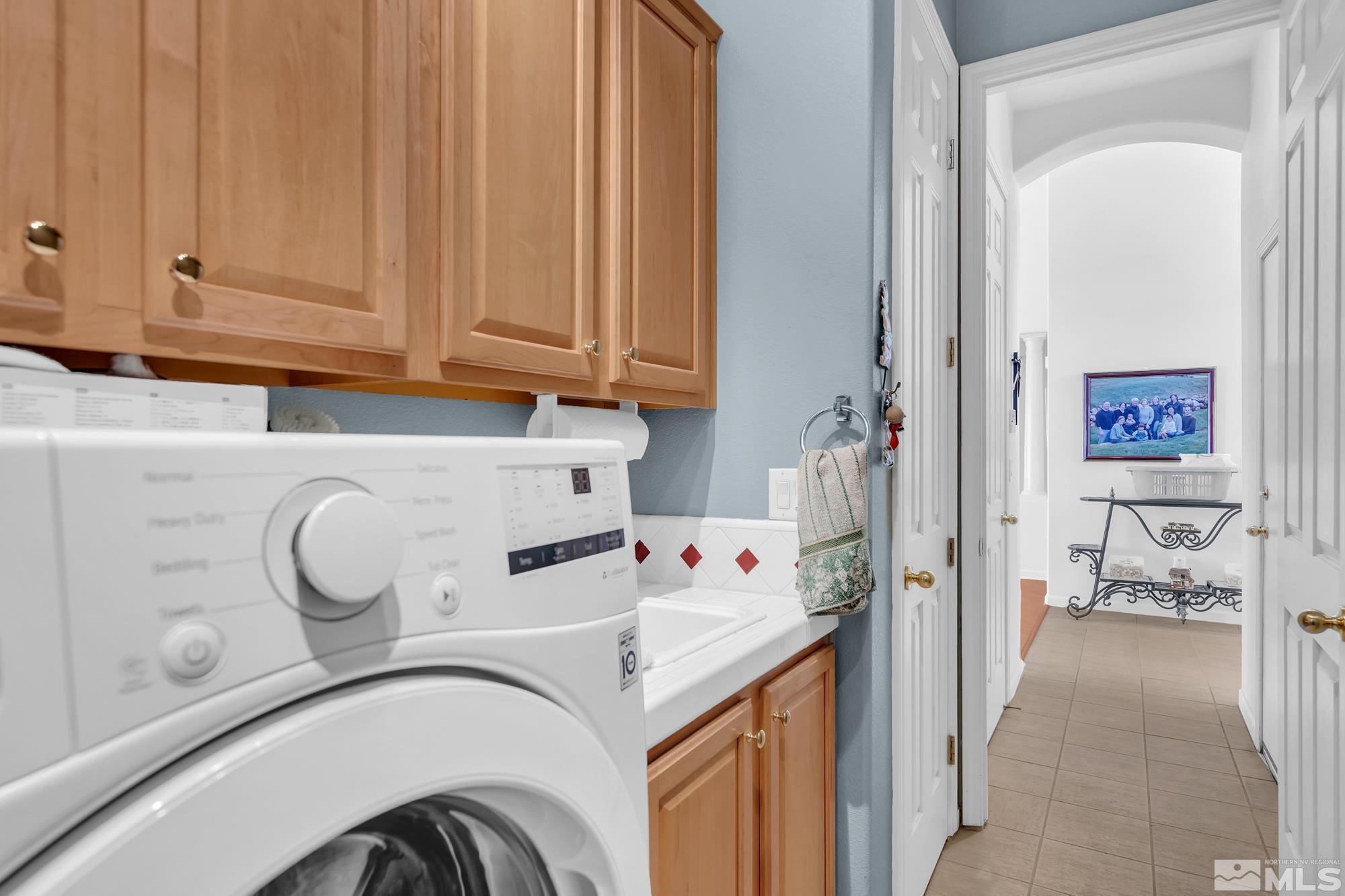 9638 Shadowstone Way Reno, NV 89521 - Photo 33 of 40 a view of entryway with washer and dryer