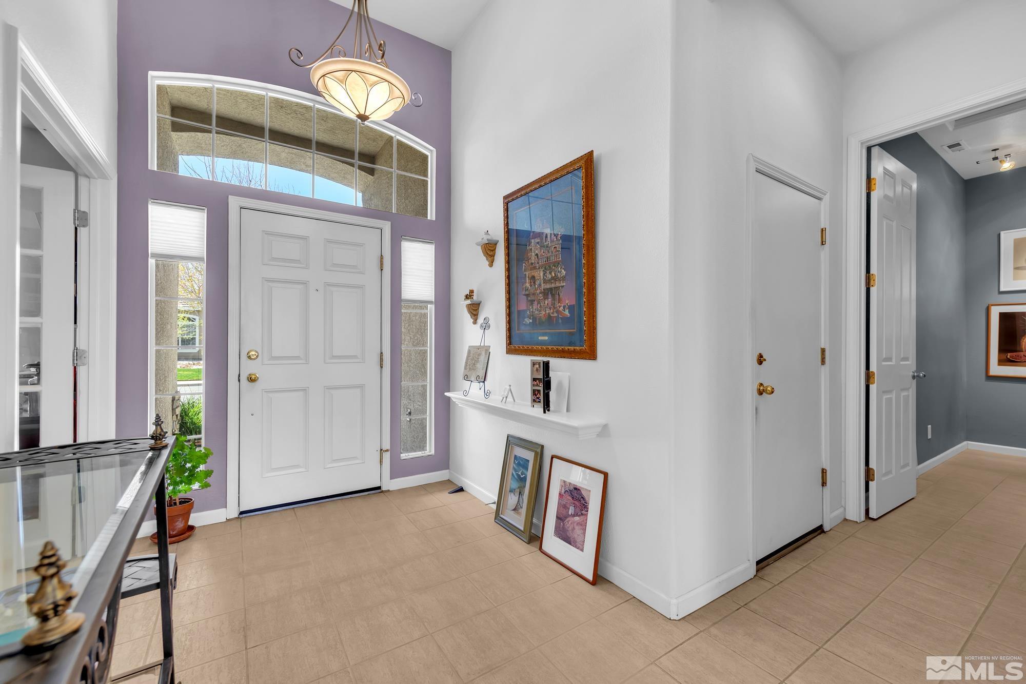 9638 Shadowstone Way Reno, NV 89521 - Photo 5 of 40 a view of an entryway with a kitchen