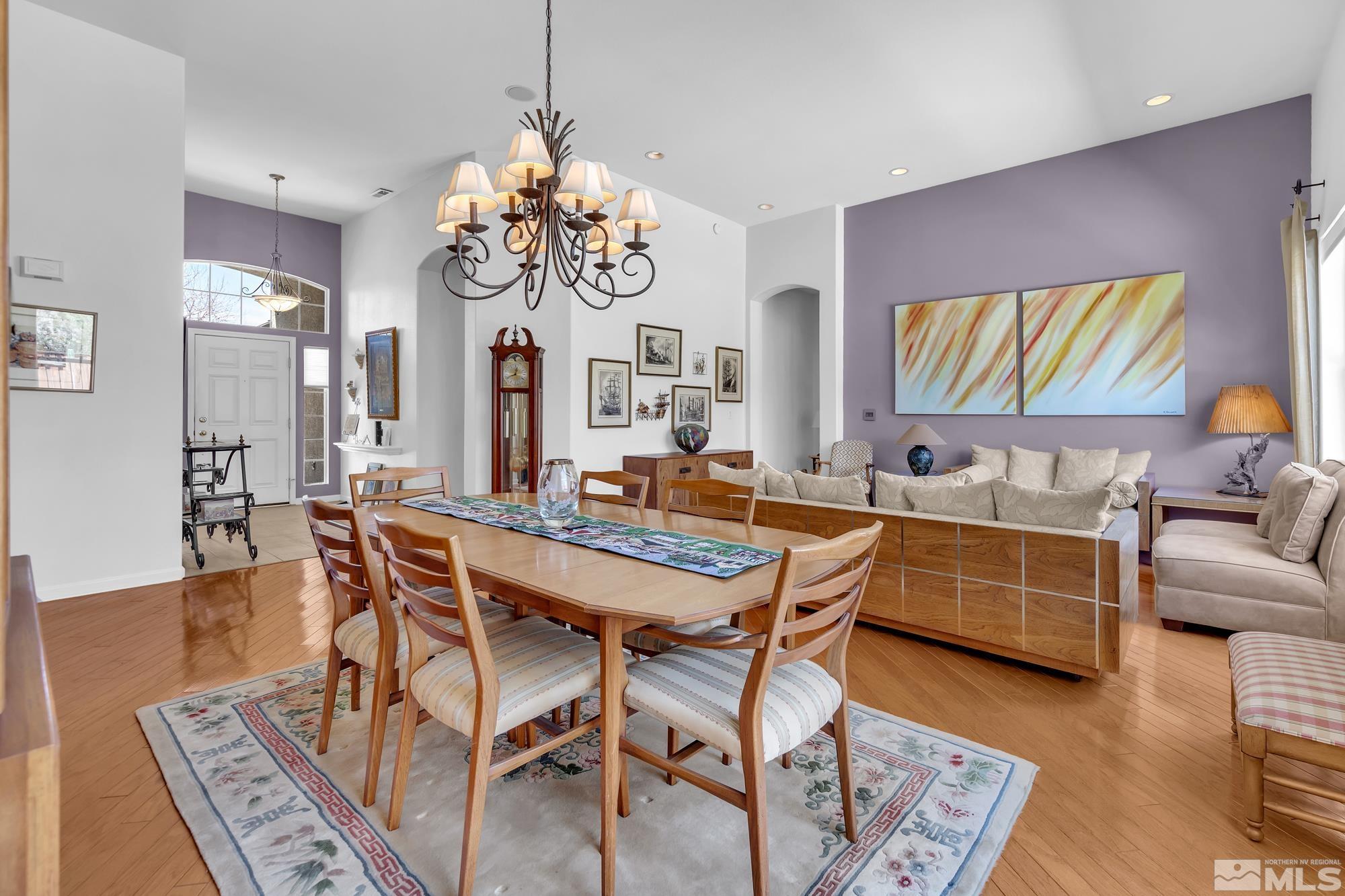 9638 Shadowstone Way Reno, NV 89521 - Photo 6 of 40 a view of a dining room with furniture wooden floor and chandelier
