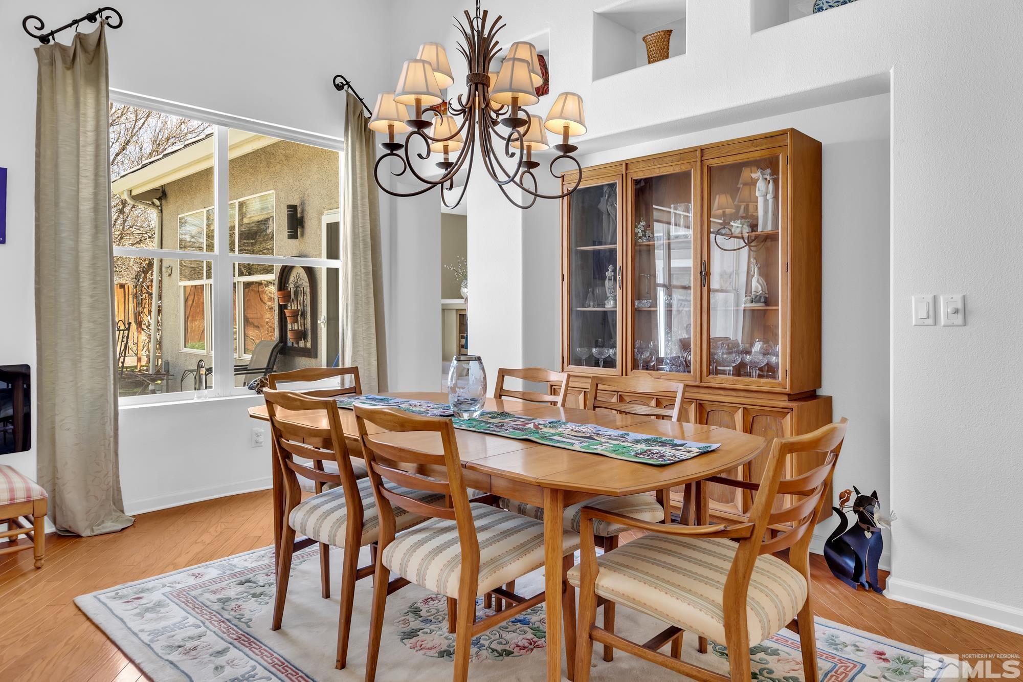 9638 Shadowstone Way Reno, NV 89521 - Photo 8 of 40 a view of a dining room with furniture and a chandelier