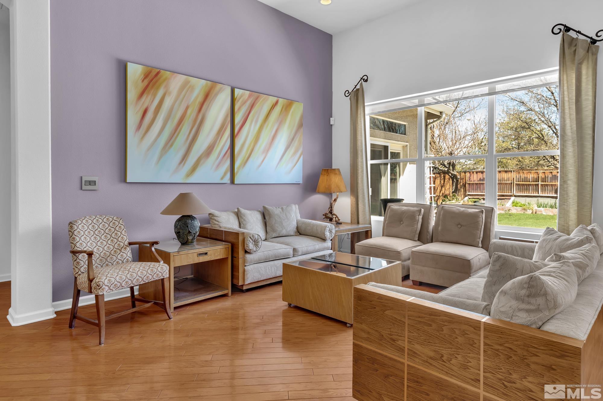9638 Shadowstone Way Reno, NV 89521 - Photo 10 of 40 a living room with furniture and a large window