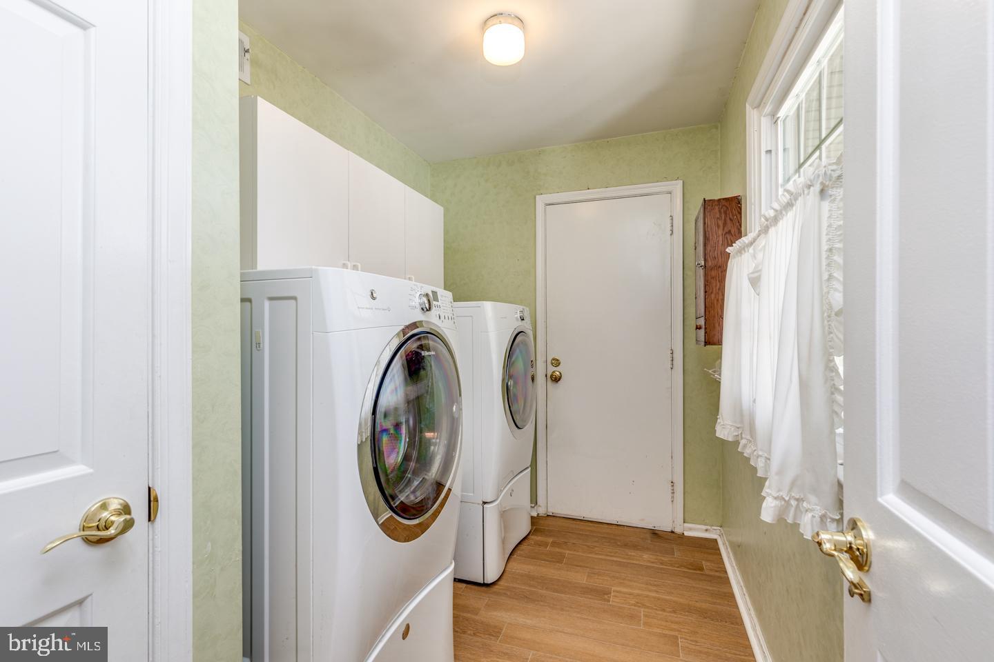 10 Wexford Court Cherry Hill, NJ 08003 - Photo 9 of 56 Laundry room with sink and entrance to garage
