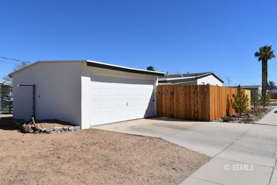 401 North Florence Street Ridgecrest, CA 93555 - Photo 20 of 21 a view of a house with a wooden fence