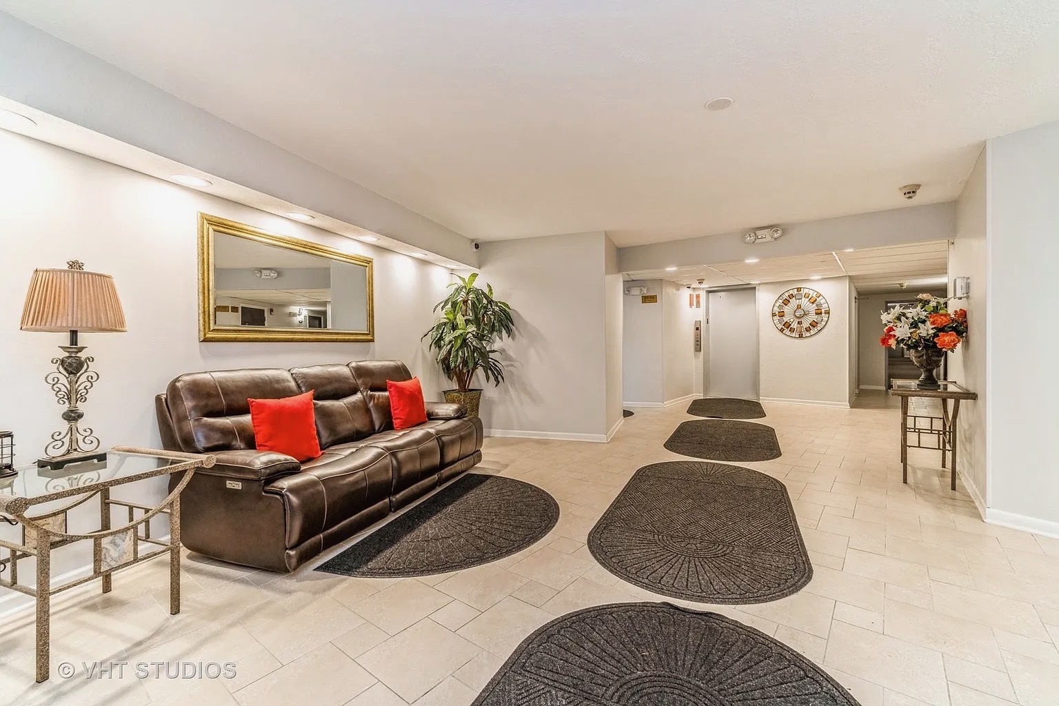 1450 Sandpebble Drive, Unit 227 Wheeling, IL 60090 - Photo 2 of 11 a living room with furniture and a flat screen tv