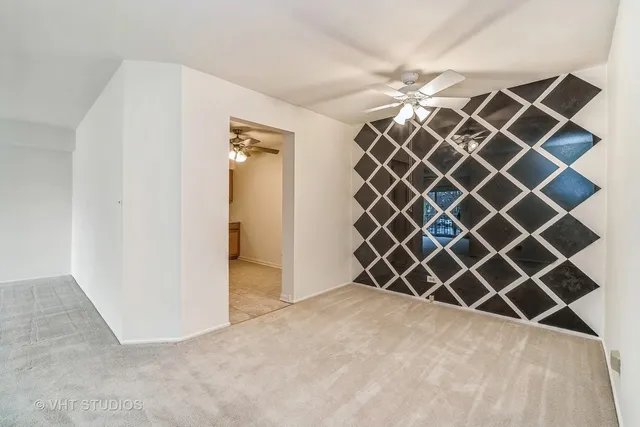 an empty room with wooden wall and a large window