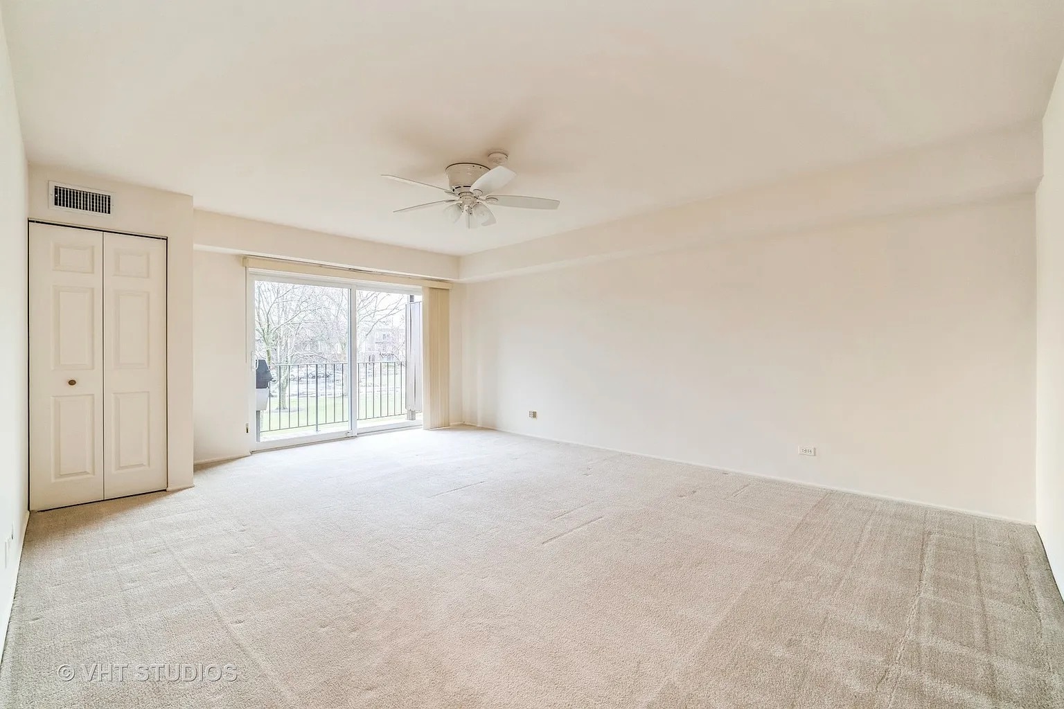 1450 Sandpebble Drive, Unit 227 Wheeling, IL 60090 - Photo 5 of 11 a view of an empty room with a window