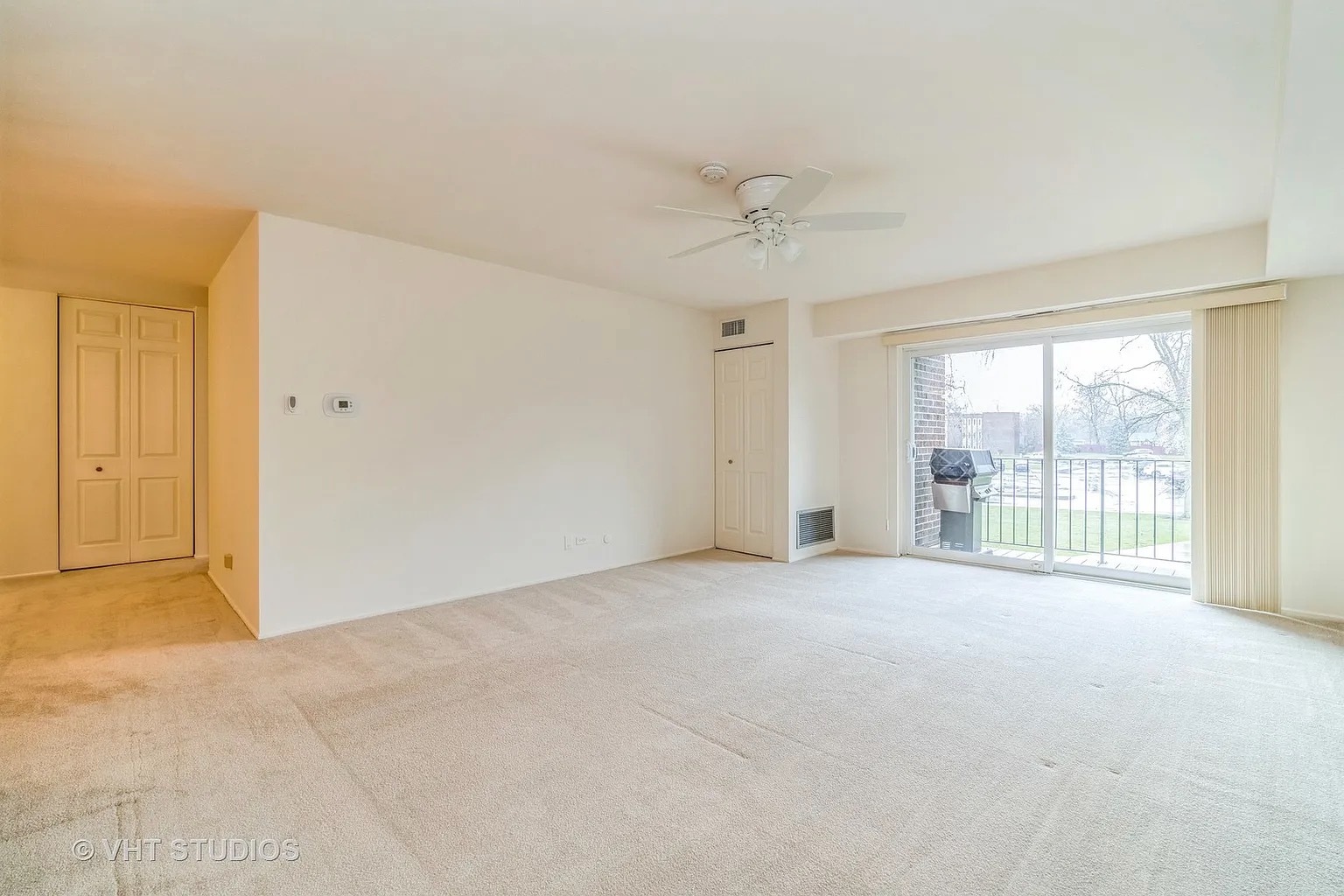 1450 Sandpebble Drive, Unit 227 Wheeling, IL 60090 - Photo 6 of 11 a view of an empty room with a window
