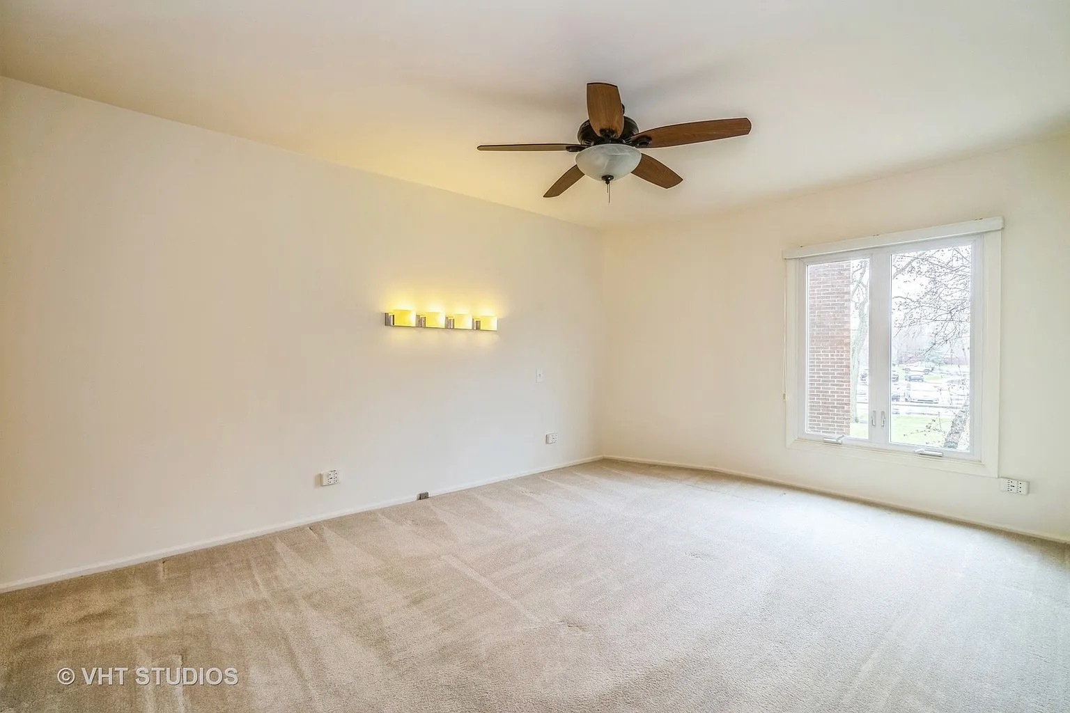 1450 Sandpebble Drive, Unit 227 Wheeling, IL 60090 - Photo 8 of 11 a view of an empty room with a window