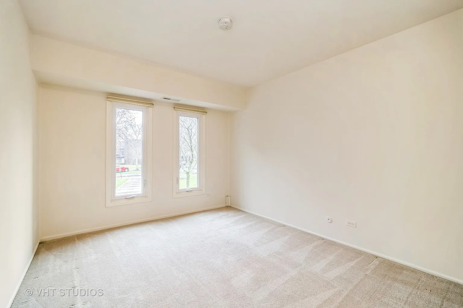 1450 Sandpebble Drive, Unit 227 Wheeling, IL 60090 - Photo 10 of 11 an empty room with windows