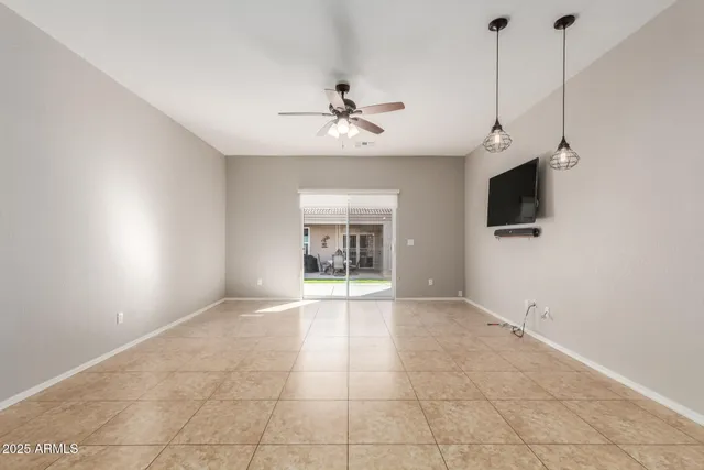 a large kitchen with stainless steel appliances granite countertop a stove and cabinets