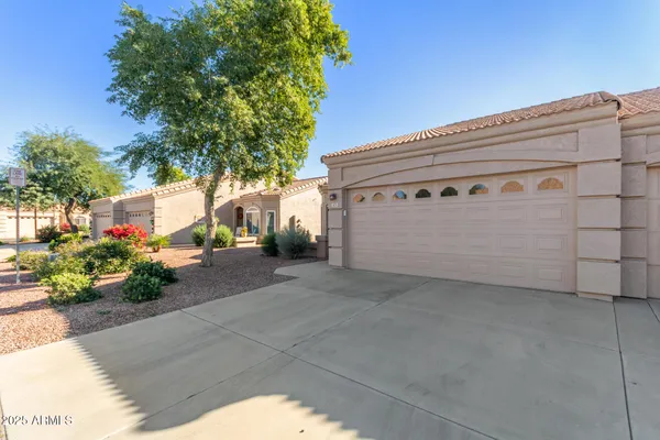 a view of a street with a garage