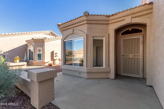 a view of a kitchen with a sink and a window