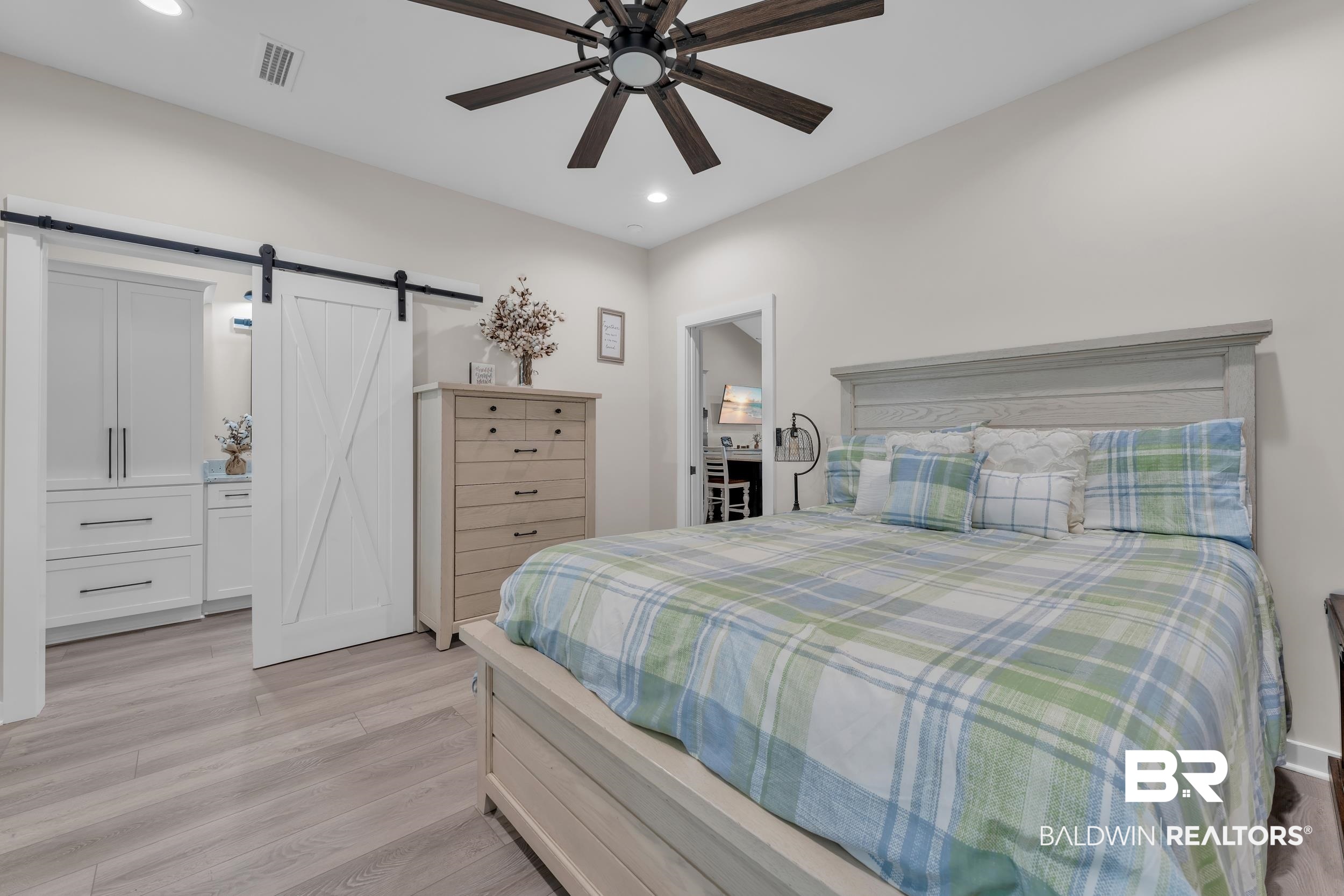 22592 Pastoral Lane Foley, AL 36535 - Photo 14 of 45 Bedroom featuring light wood-type flooring, recessed lighting, a barn door, and ceiling fan