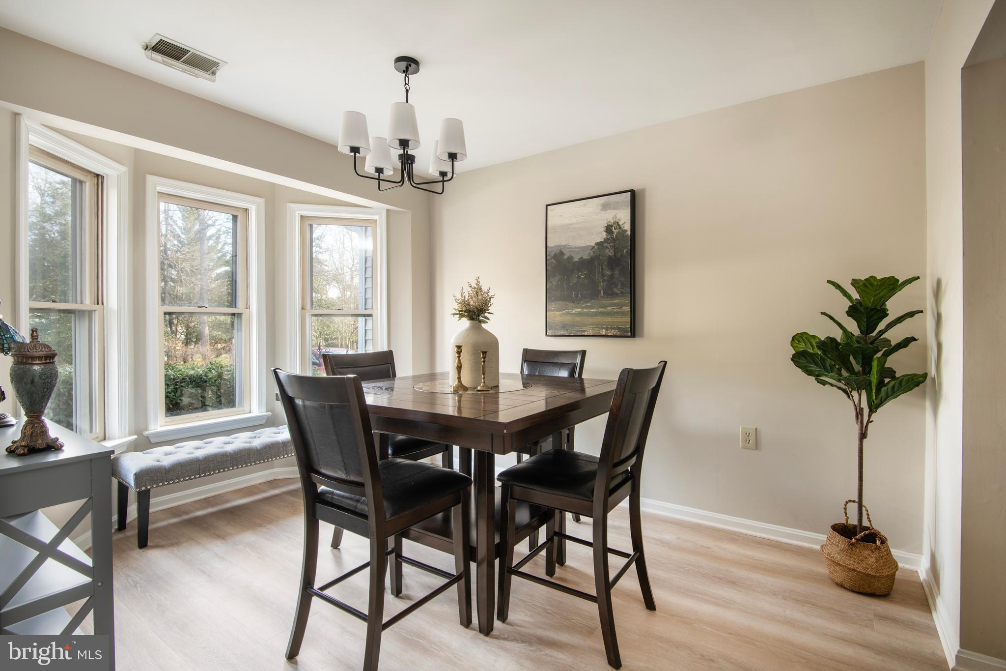 992 Riversedge Circle Annapolis, MD 21401 - Photo 13 of 35 a view of a dining room with furniture window and wooden floor