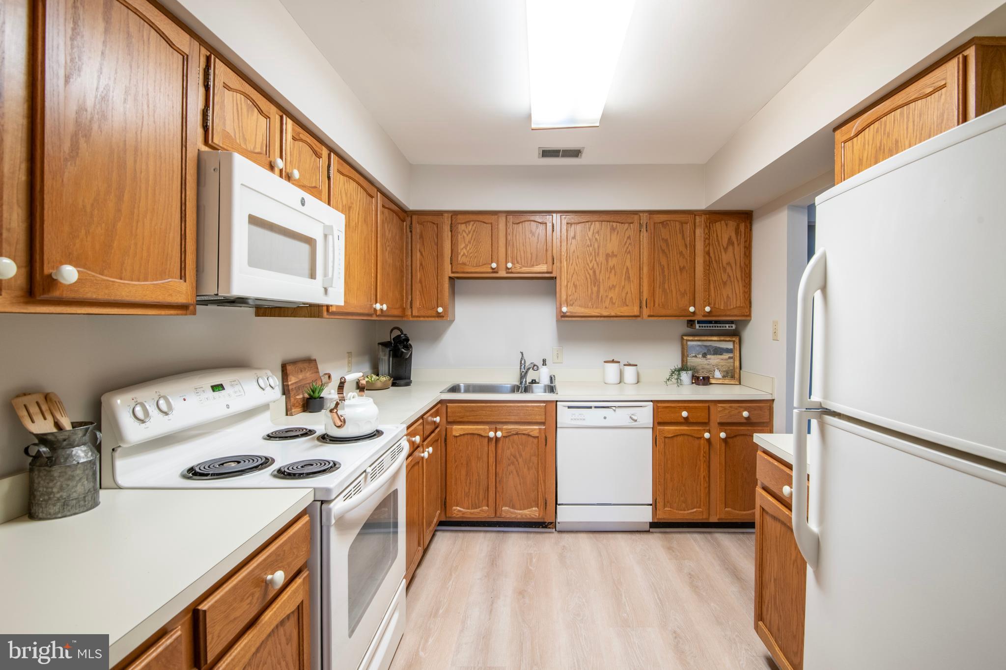 992 Riversedge Circle Annapolis, MD 21401 - Photo 19 of 35 a kitchen with a sink a stove and refrigerator