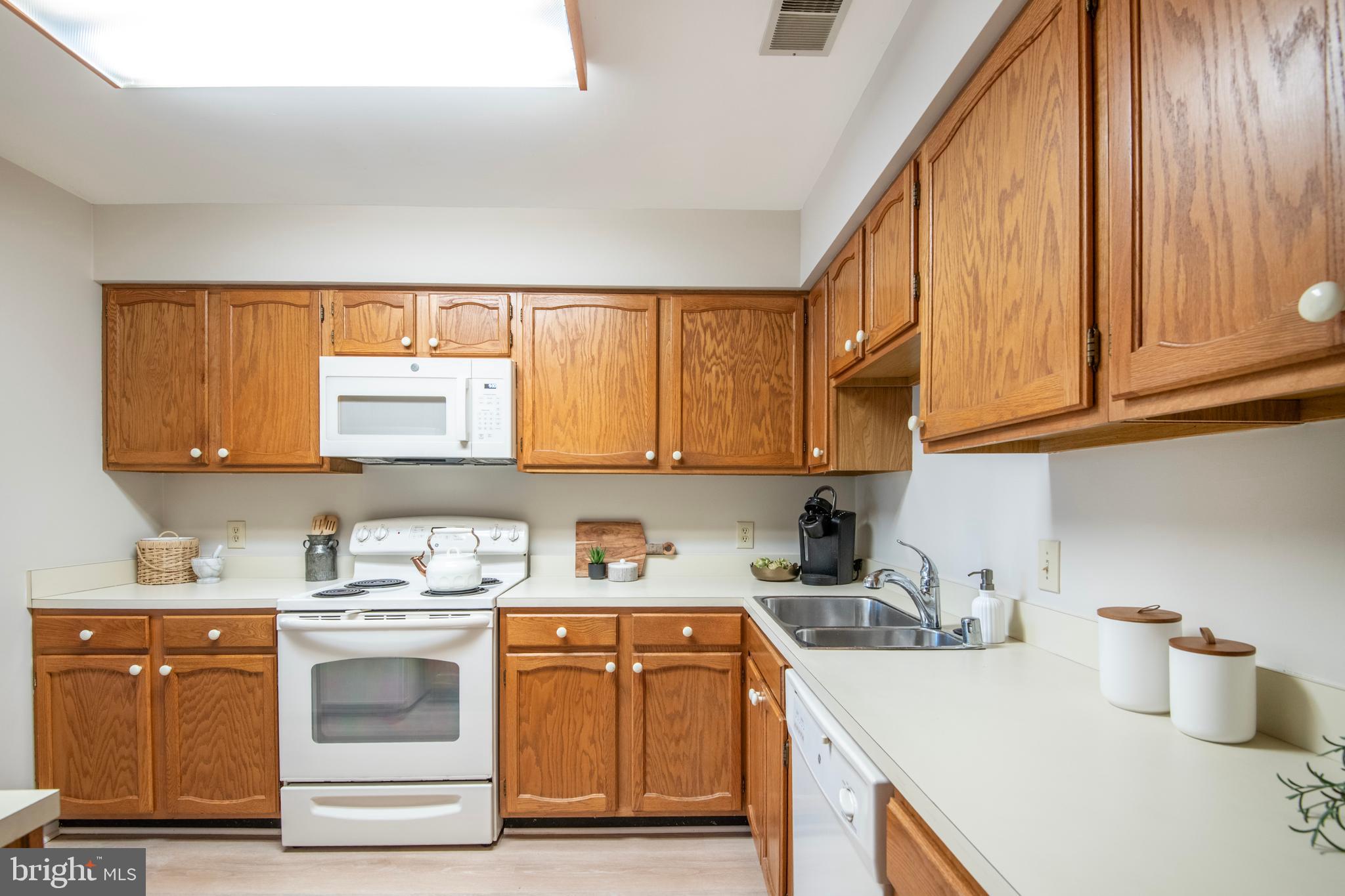 992 Riversedge Circle Annapolis, MD 21401 - Photo 20 of 35 a kitchen with a sink cabinets and window