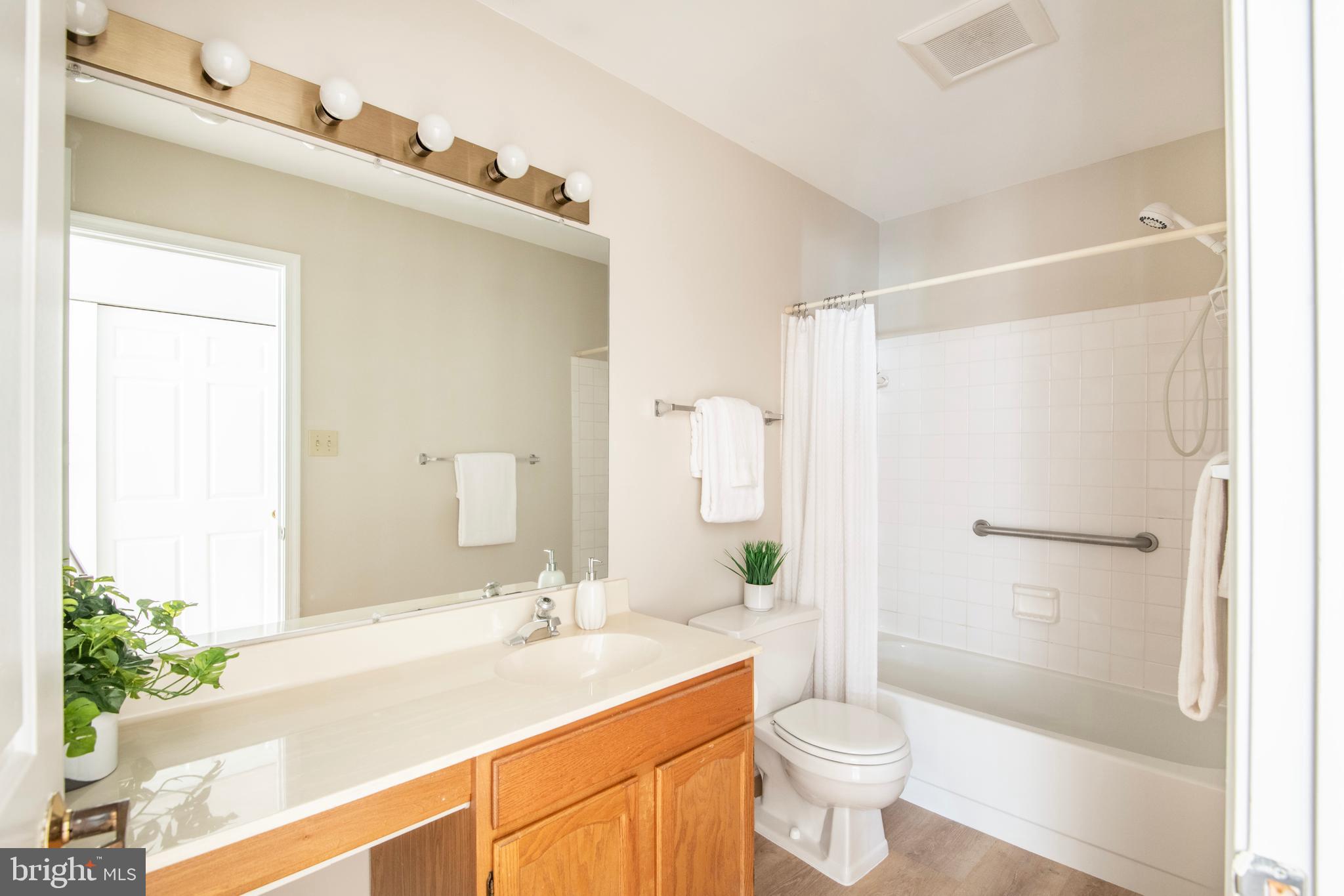 992 Riversedge Circle Annapolis, MD 21401 - Photo 26 of 35 a bathroom with a sink a toilet and shower