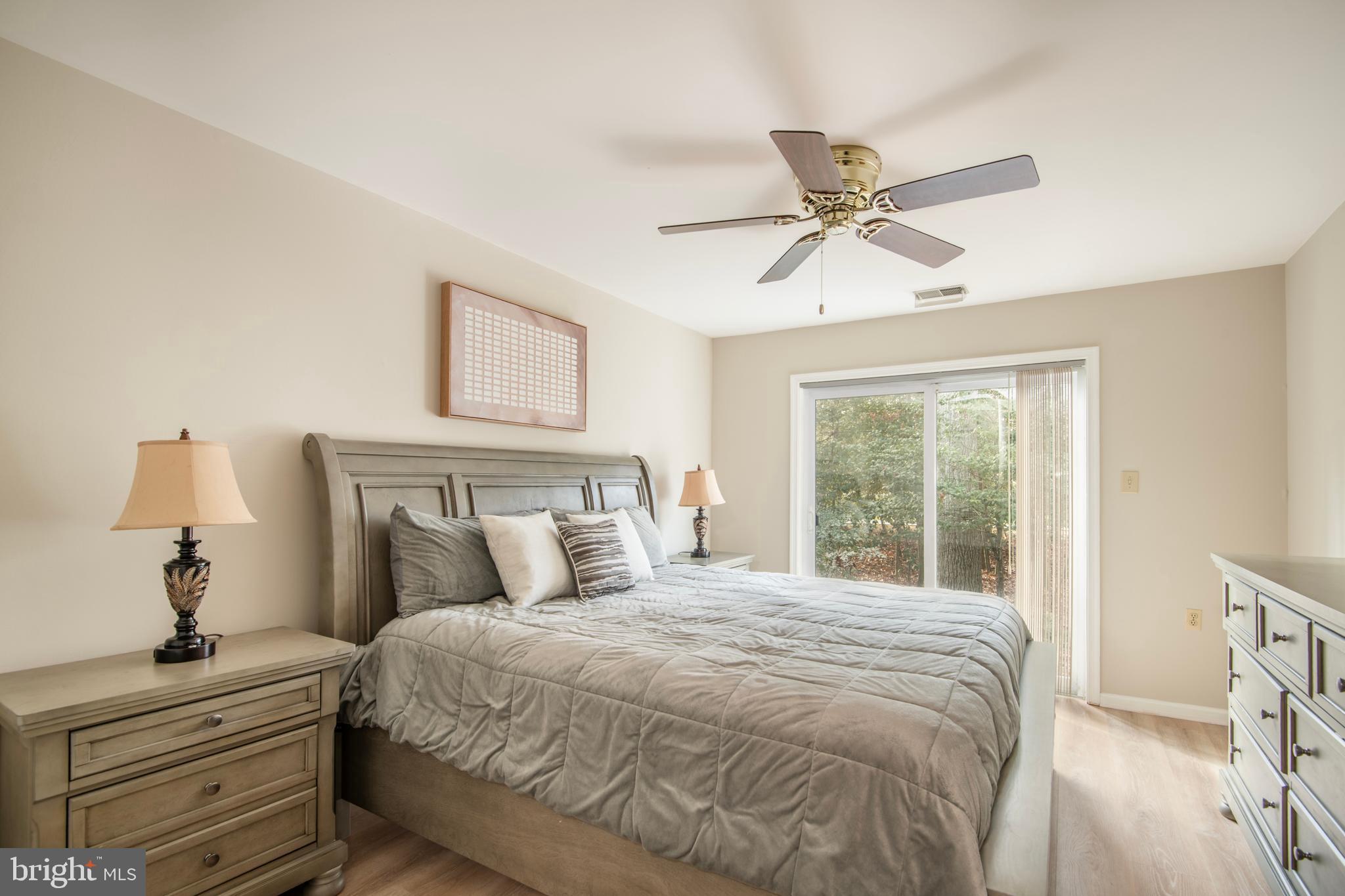 992 Riversedge Circle Annapolis, MD 21401 - Photo 28 of 35 a bedroom with a bed and a chandelier