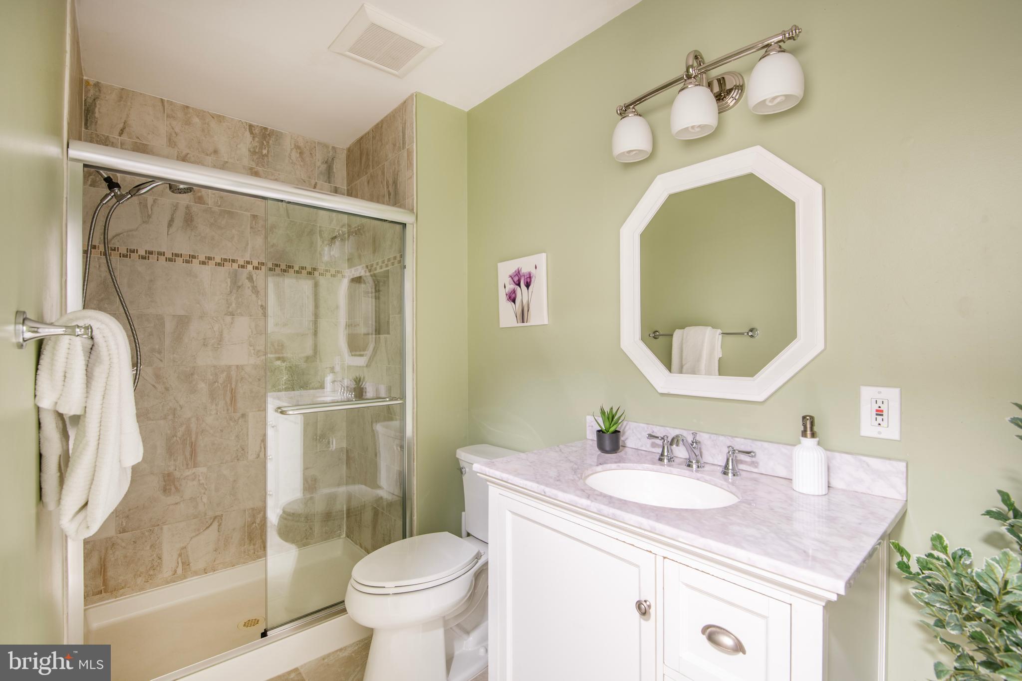 992 Riversedge Circle Annapolis, MD 21401 - Photo 30 of 35 a bathroom with a sink toilet and shower