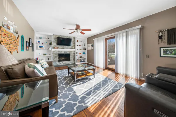a bedroom with furniture or flat screen tv and a fireplace