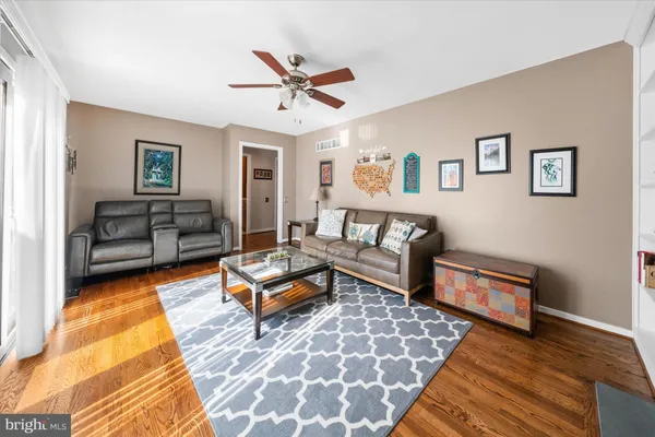 a living room with furniture and a rug