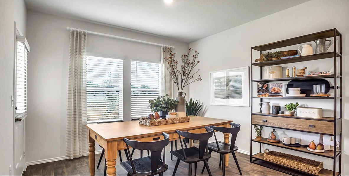 11524 Rush Lane Elgin, TX 78621 - Photo 12 of 29 Dining space featuring dark wood-type flooring and baseboards
