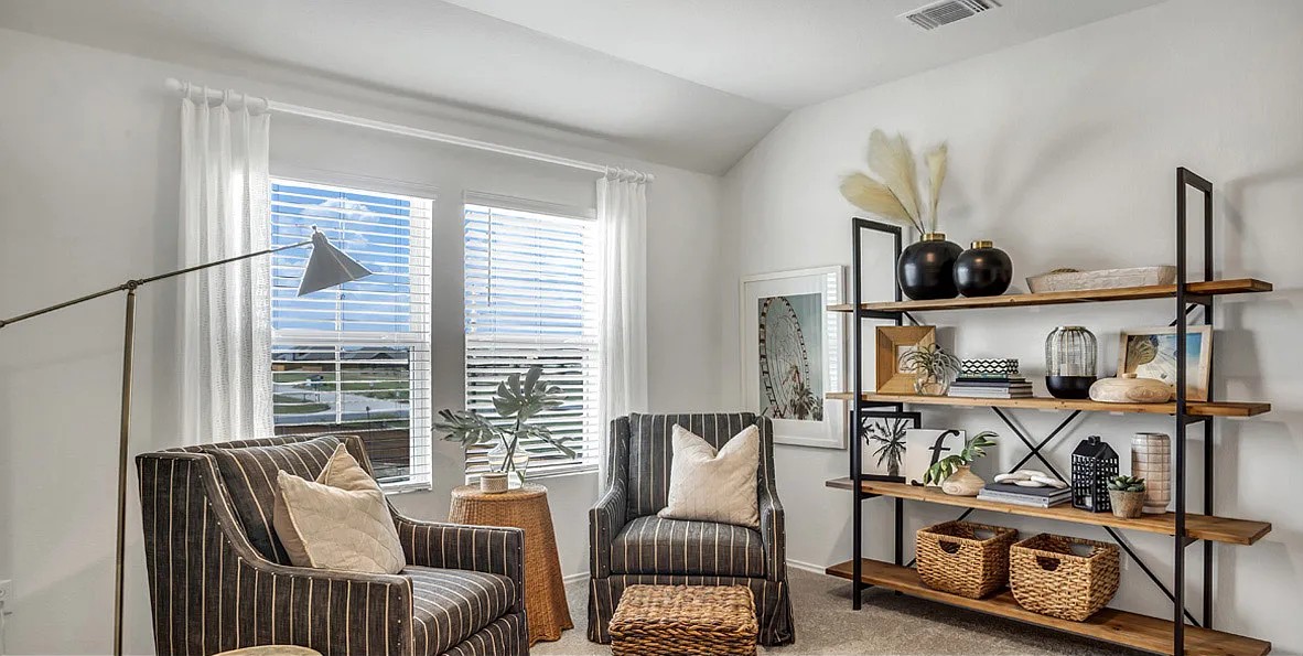11524 Rush Lane Elgin, TX 78621 - Photo 15 of 29 Living area with light colored carpet and vaulted ceiling