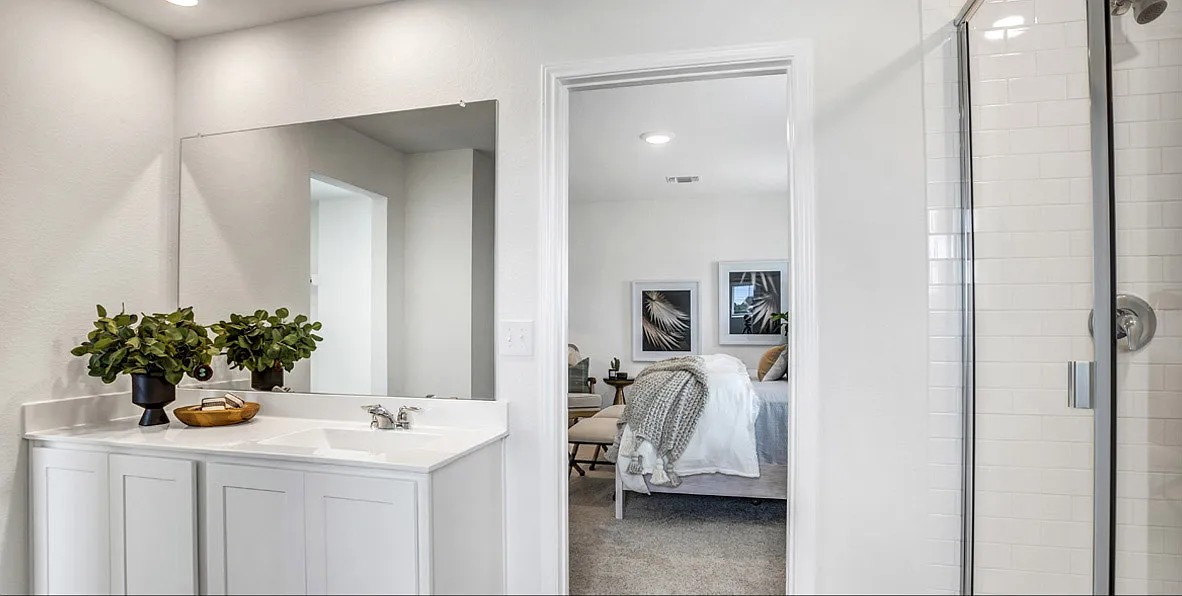 11524 Rush Lane Elgin, TX 78621 - Photo 25 of 29 Ensuite bathroom with a shower stall, vanity, carpet flooring, and recessed lighting
