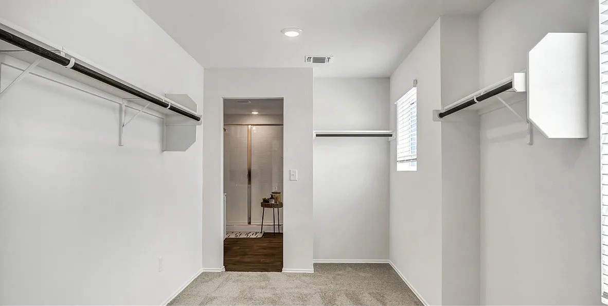 11524 Rush Lane Elgin, TX 78621 - Photo 27 of 29 Walk in closet with light colored carpet