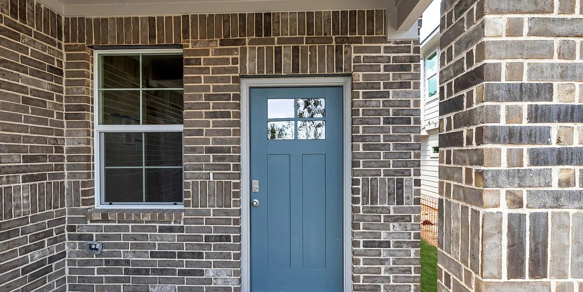 11524 Rush Lane Elgin, TX 78621 - Photo 3 of 29 View of exterior entry featuring brick siding