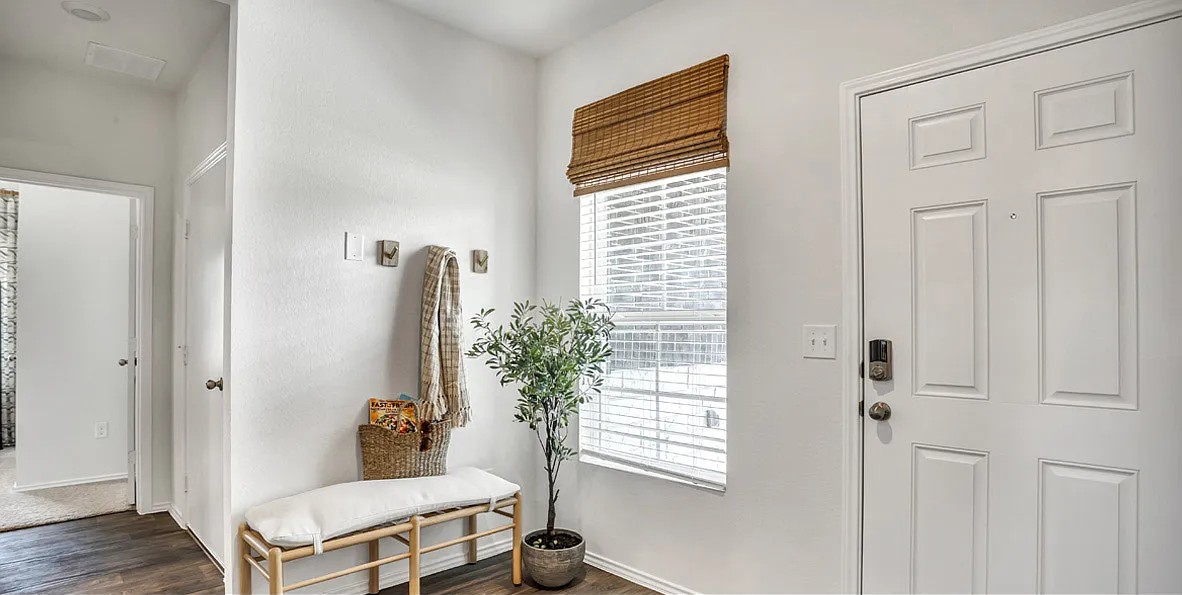 11524 Rush Lane Elgin, TX 78621 - Photo 5 of 29 Foyer with dark wood-type flooring and baseboards