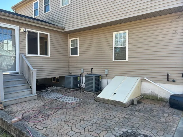 a view of a house with a yard and a balcony