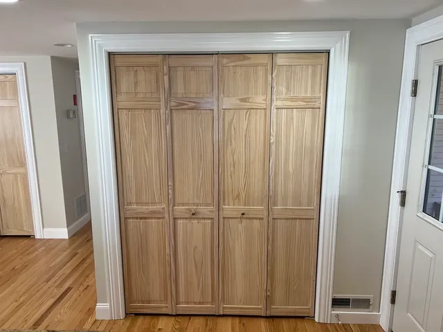 an empty room with wooden floor