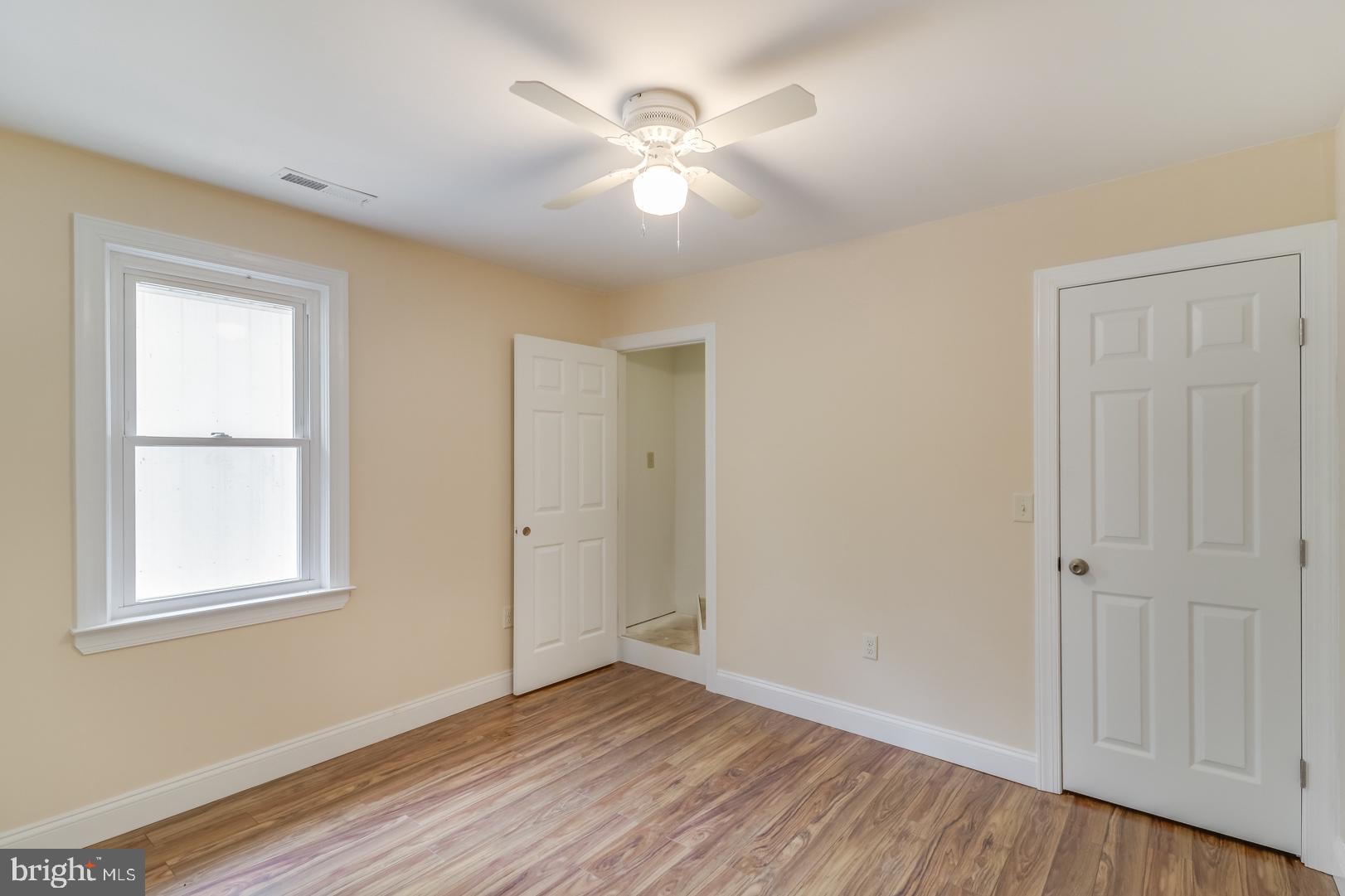 5868 Rock Hall Road Rock Hall, MD 21661 - Photo 14 of 39 Large guest bedroom with access to attic