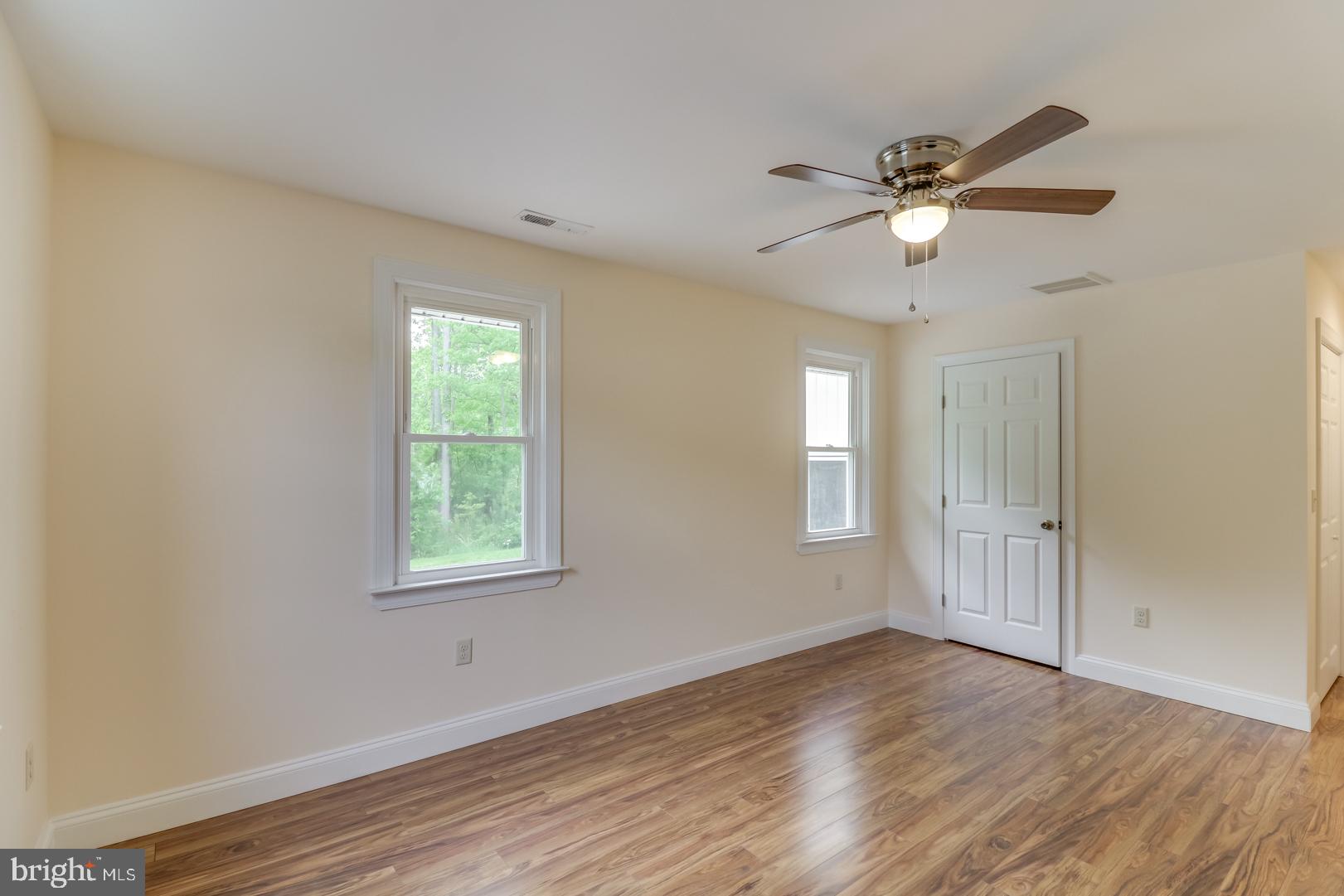 5868 Rock Hall Road Rock Hall, MD 21661 - Photo 15 of 39 Large guest bedroom with access to attic