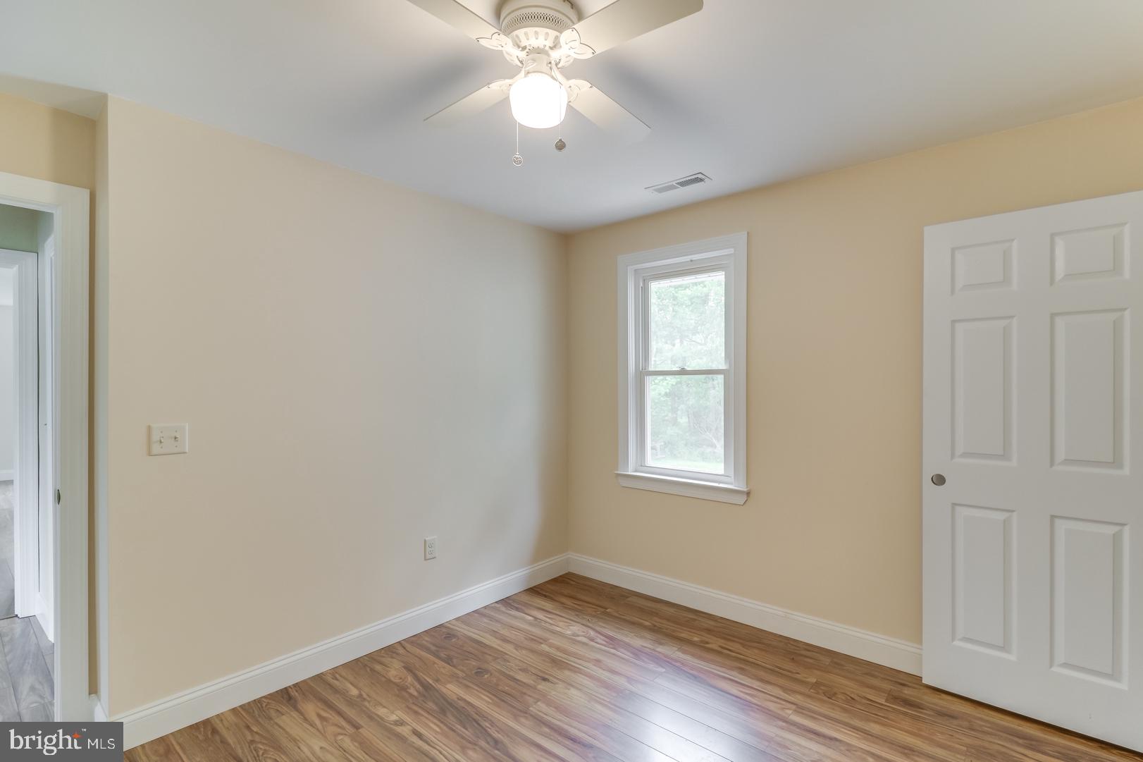 5868 Rock Hall Road Rock Hall, MD 21661 - Photo 17 of 39 Large guest bedroom with walk in closet