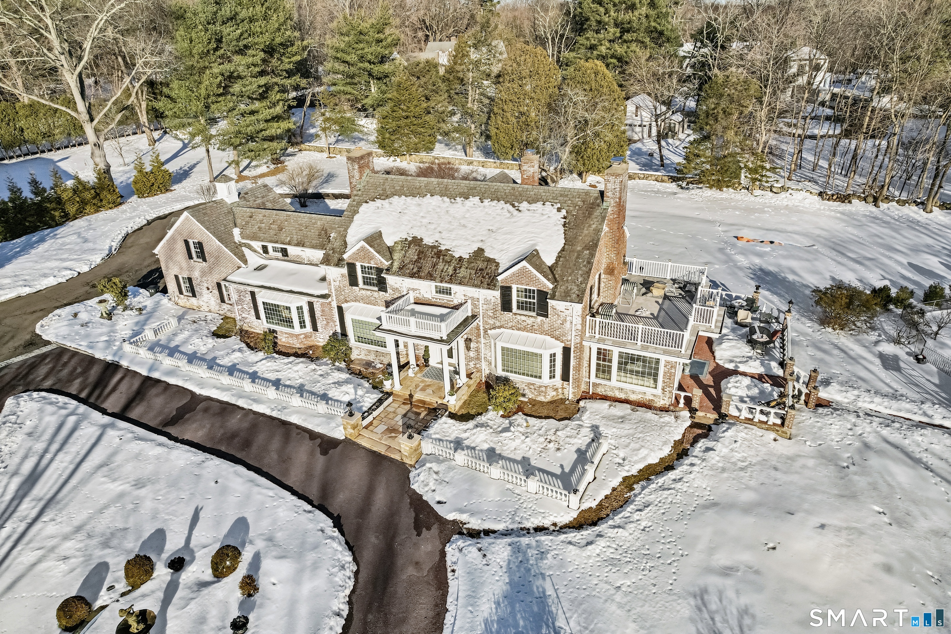 an aerial view of a house with a swimming pool