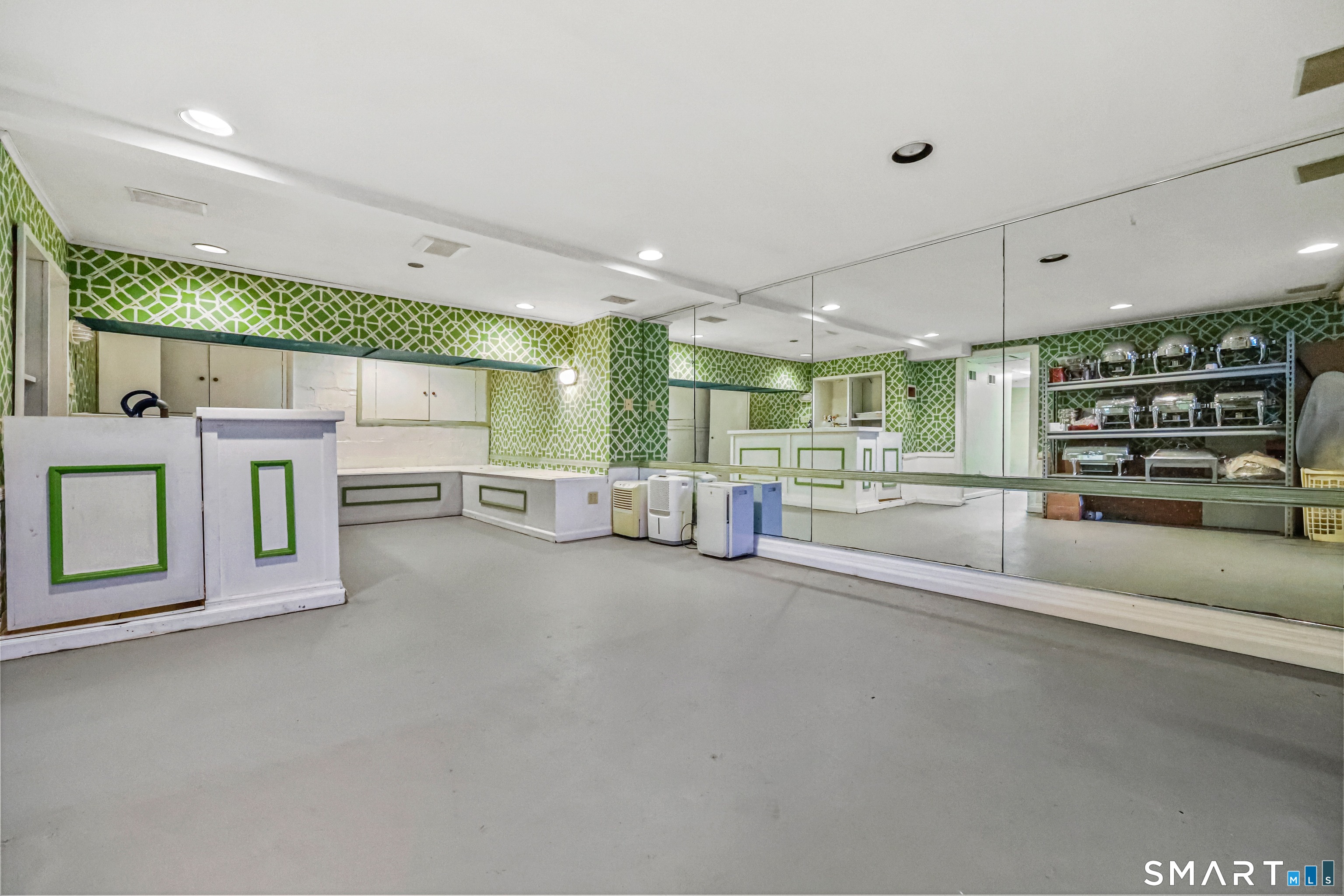 1209 Westover Road Stamford, CT 06902 - Photo 17 of 43 a large white building with a lot of living room