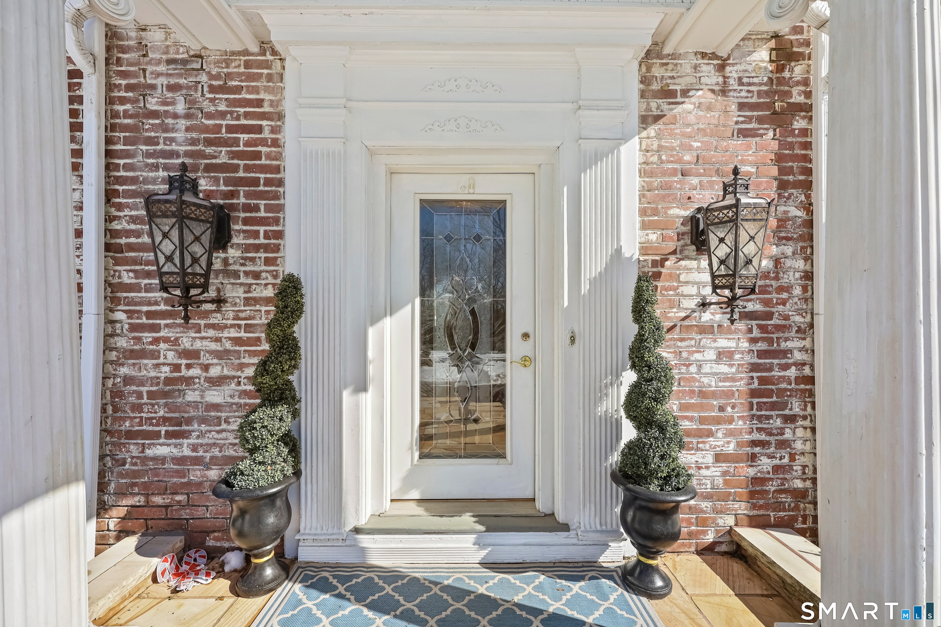 1209 Westover Road Stamford, CT 06902 - Photo 2 of 43 a front view of a house with a potted plant