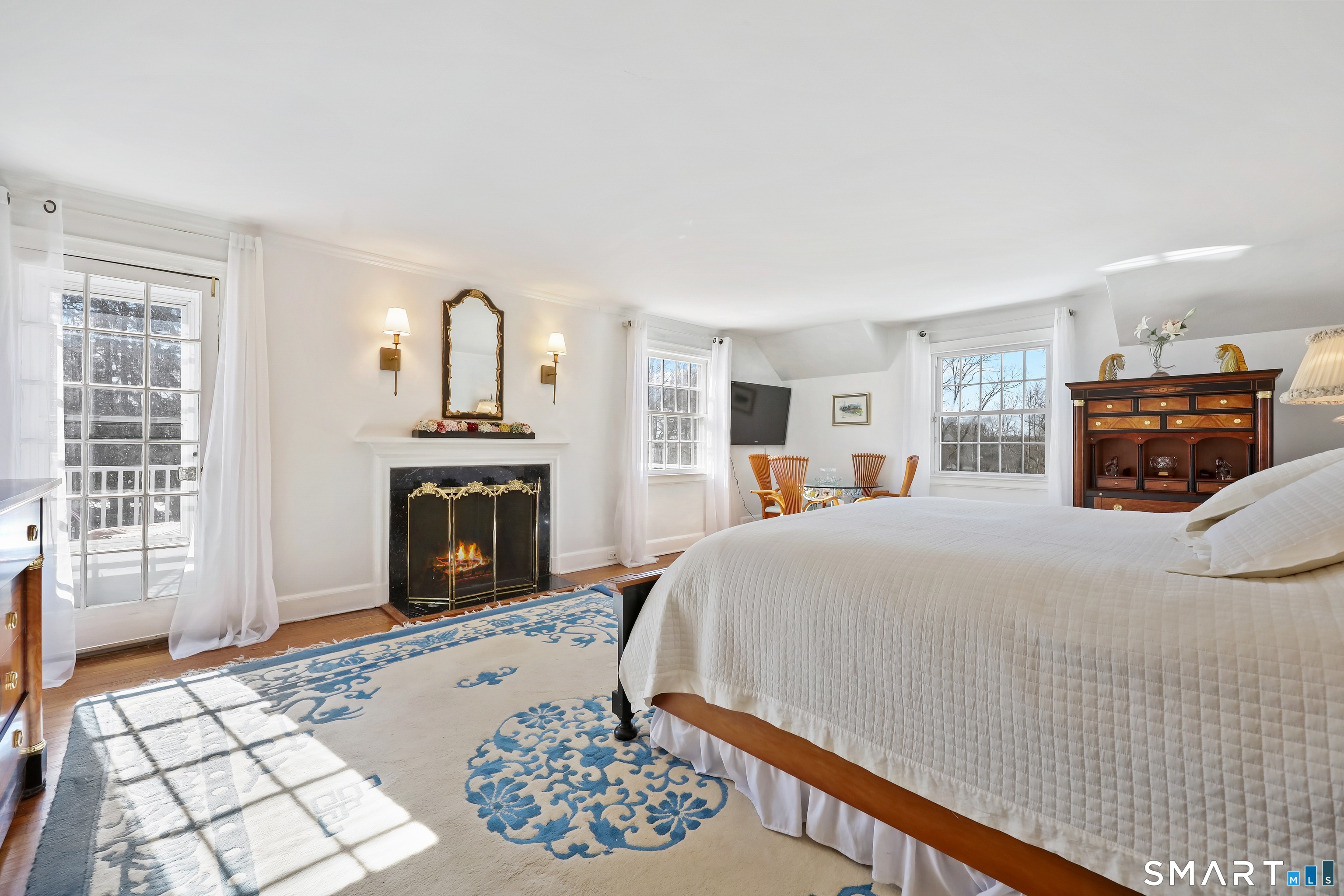 1209 Westover Road Stamford, CT 06902 - Photo 23 of 43 a bed room with a bed and a fireplace