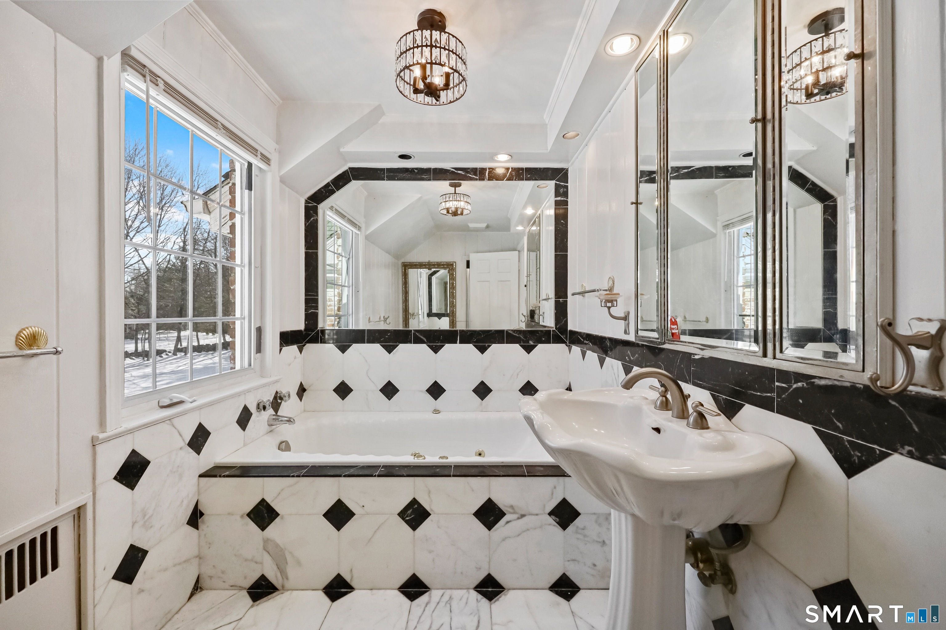 1209 Westover Road Stamford, CT 06902 - Photo 24 of 43 a bathroom with a sink and a mirror