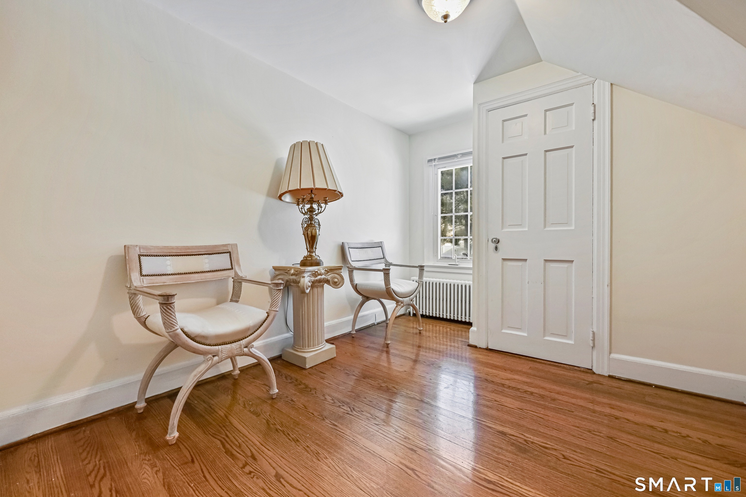1209 Westover Road Stamford, CT 06902 - Photo 27 of 43 a living room with furniture a window and a table