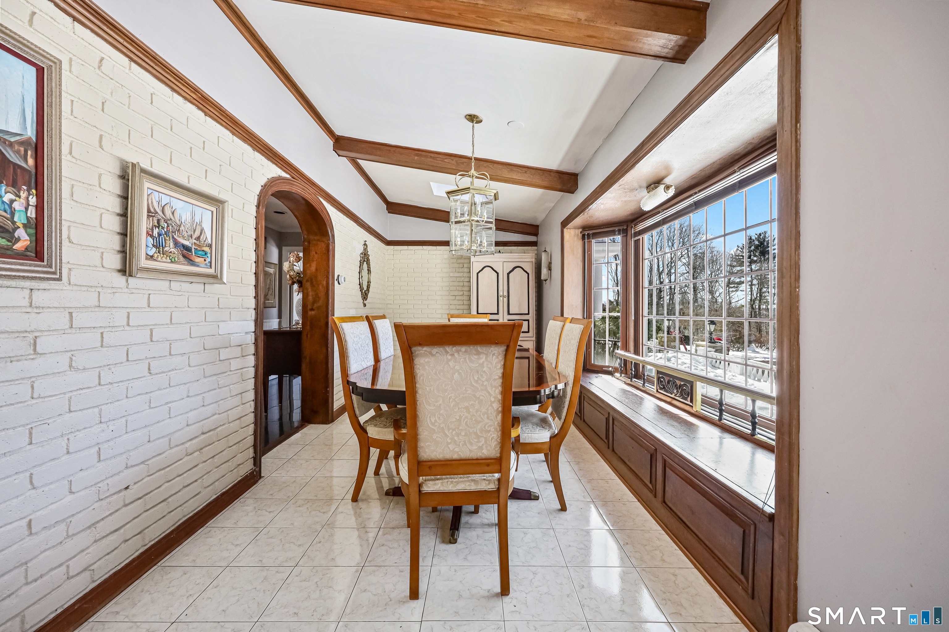 1209 Westover Road Stamford, CT 06902 - Photo 30 of 43 a dining room with furniture and a floor to ceiling window