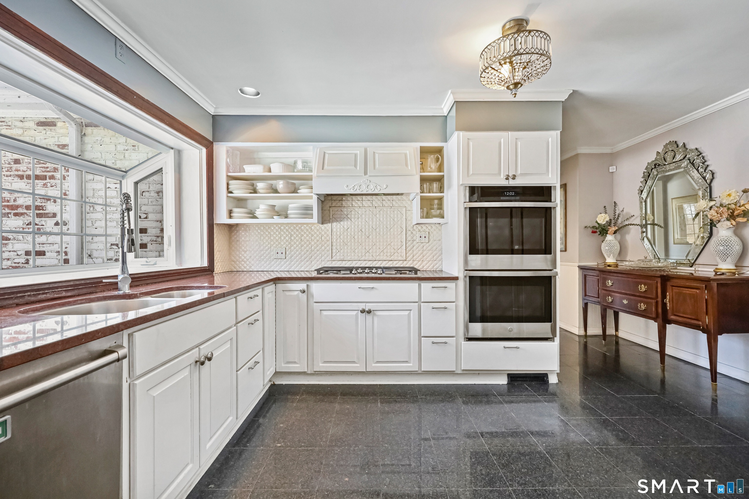 1209 Westover Road Stamford, CT 06902 - Photo 33 of 43 a kitchen with cabinets and window