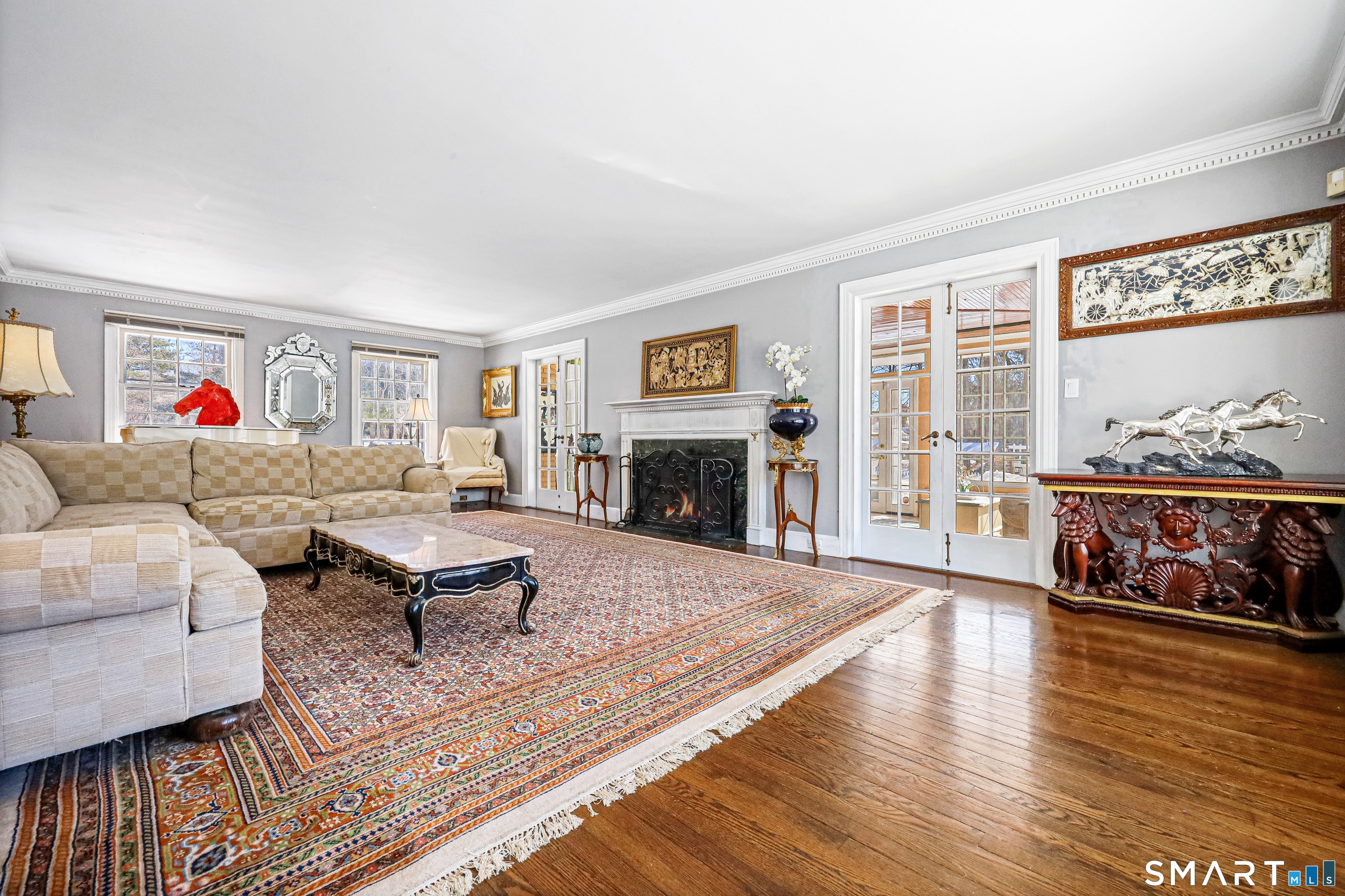 1209 Westover Road Stamford, CT 06902 - Photo 40 of 43 a living room with furniture large window and wooden floor