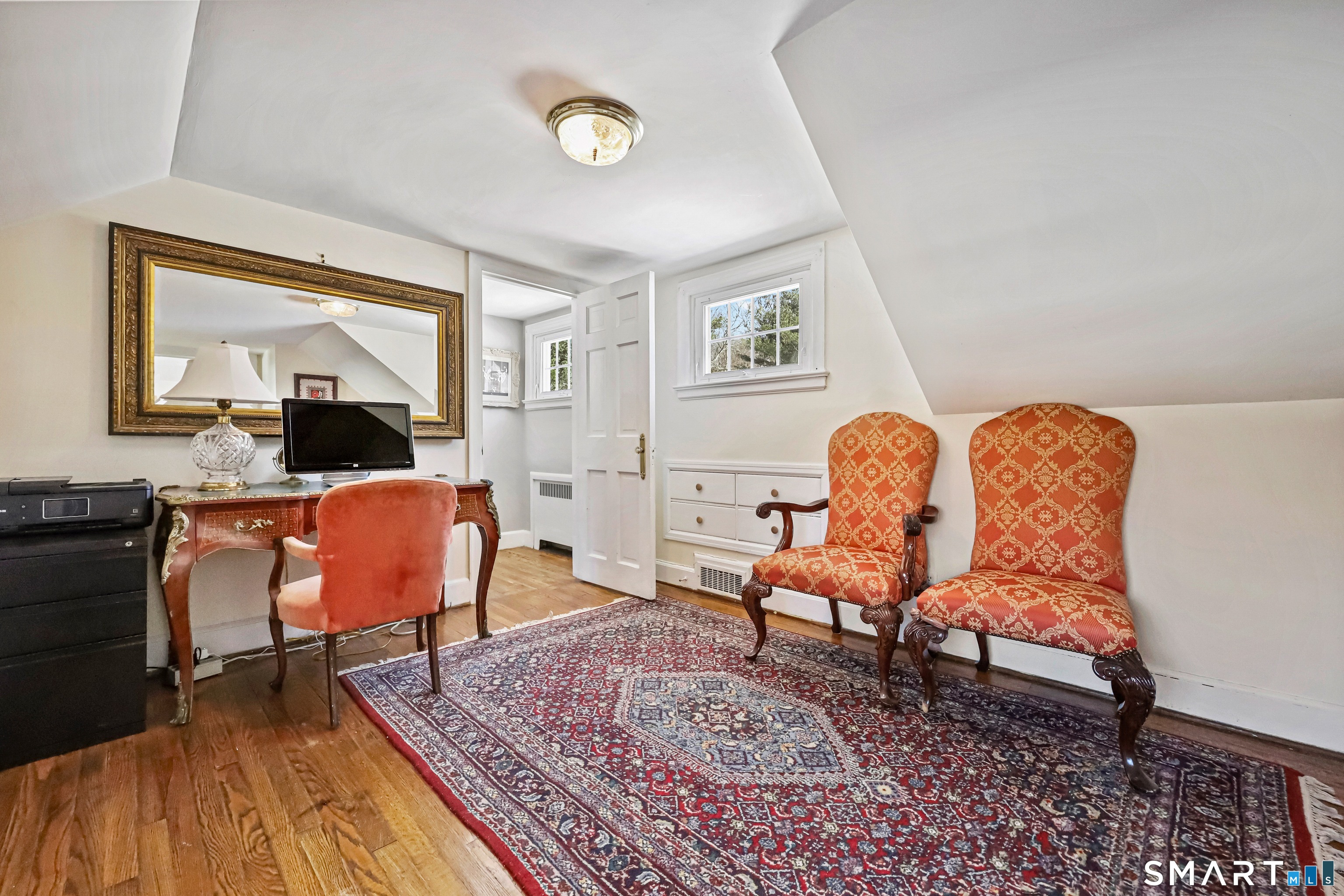 1209 Westover Road Stamford, CT 06902 - Photo 9 of 43 a living room with furniture and a rug
