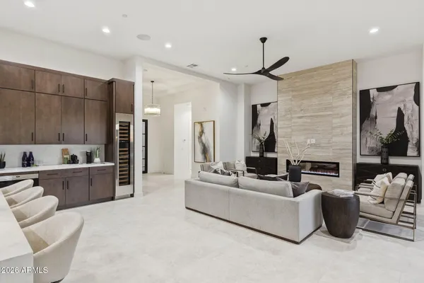a living room with fireplace furniture and a flat screen tv